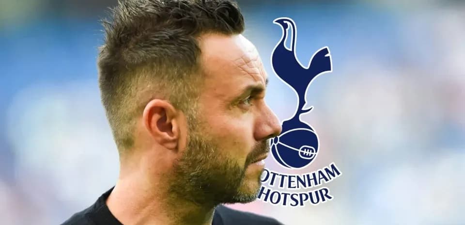 Entrenador mirando hacia un lado con logo de Tottenham
