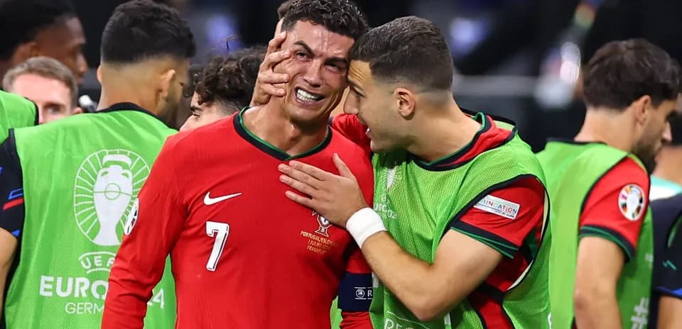 Cristiano Ronaldo being consoled by teammate after match