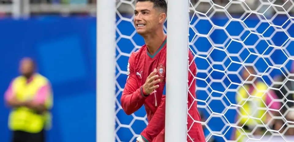 Cristiano Ronaldo gesturing near the goalpost