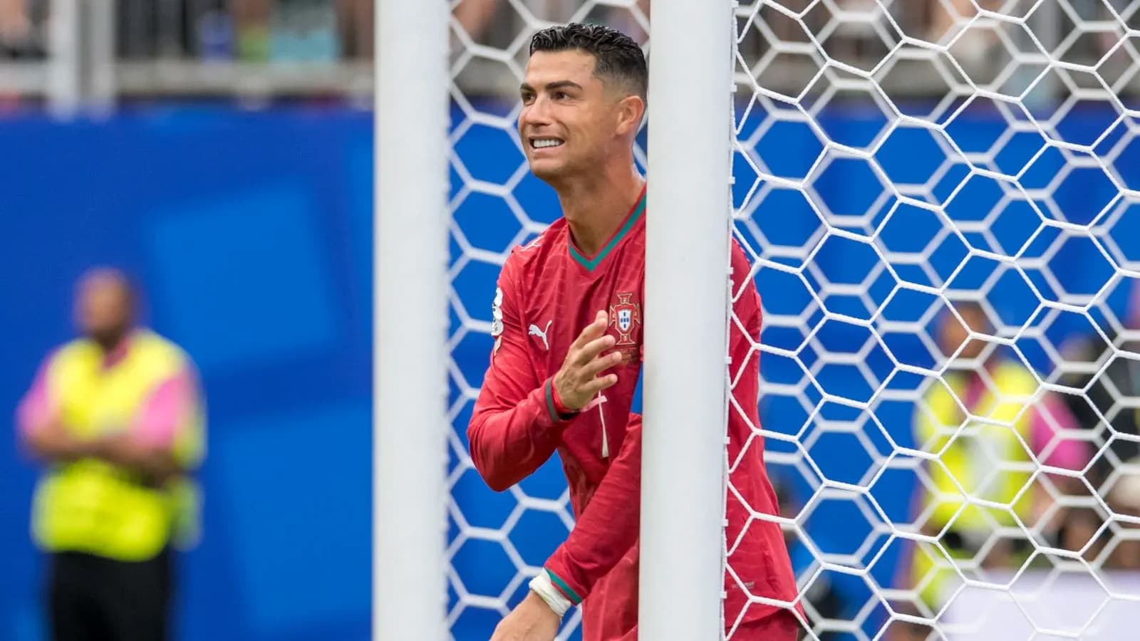 Cristiano Ronaldo gesturing near the goalpost