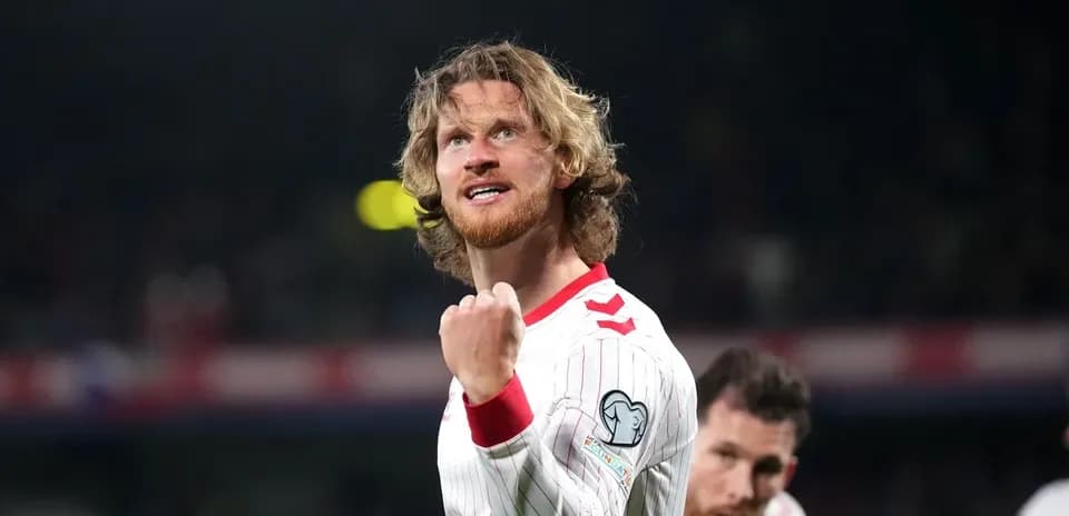 Jugador celebrando en partido de clasificación