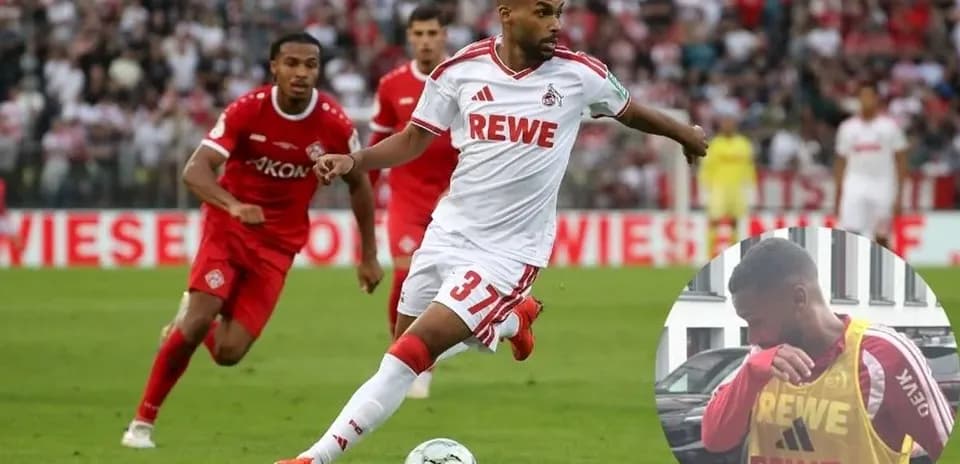 Jugador de FC Köln corriendo con el balón en partido