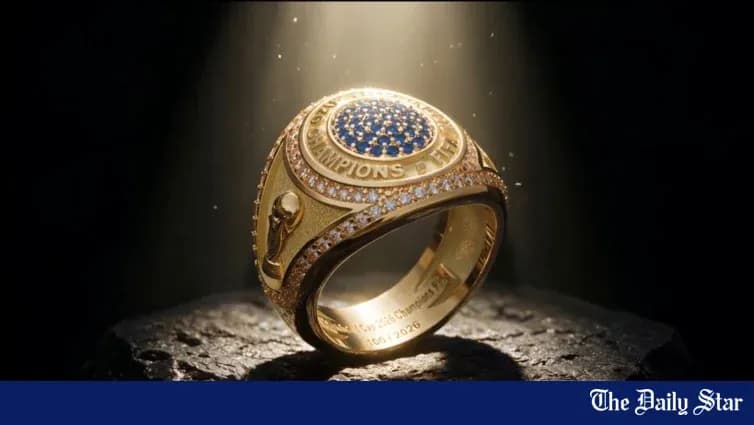 An illuminated championship ring on a stone surface An illuminated championship ring on a stone surface