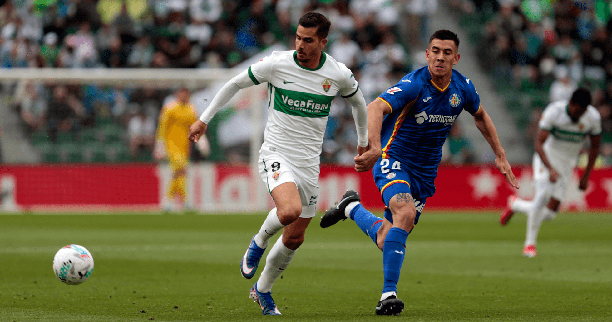 Jugadores de Elche y Getafe en acción Jugadores de Elche y Getafe en acción