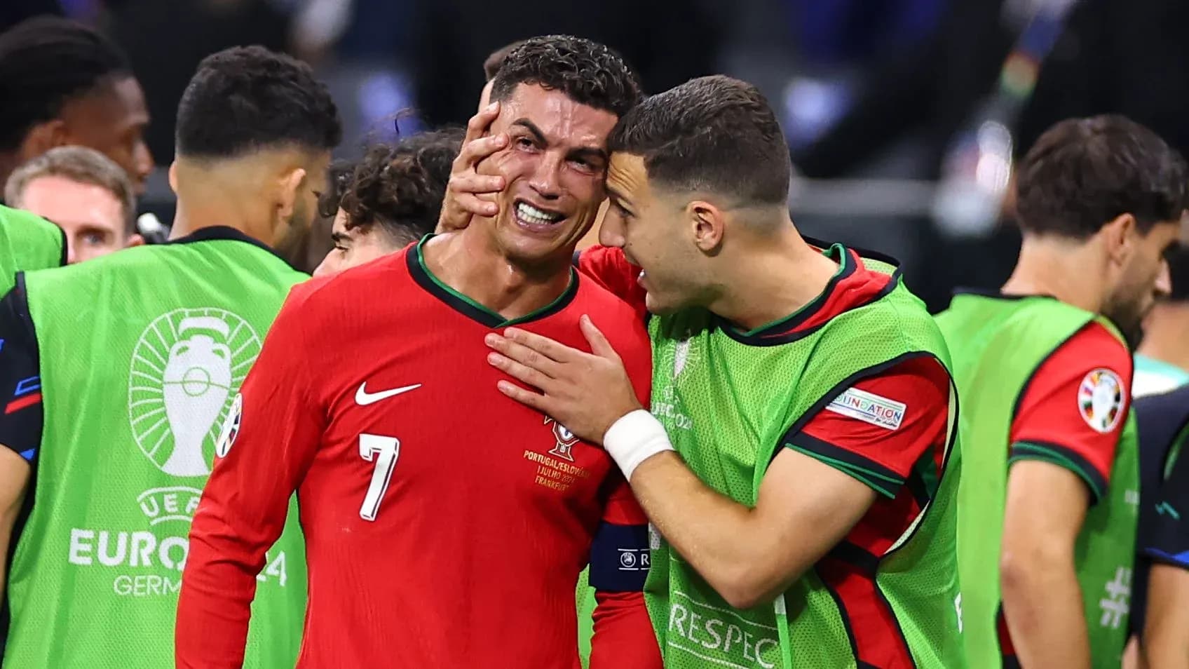 Cristiano Ronaldo being consoled by teammate after match Cristiano Ronaldo being consoled by teammate after match
