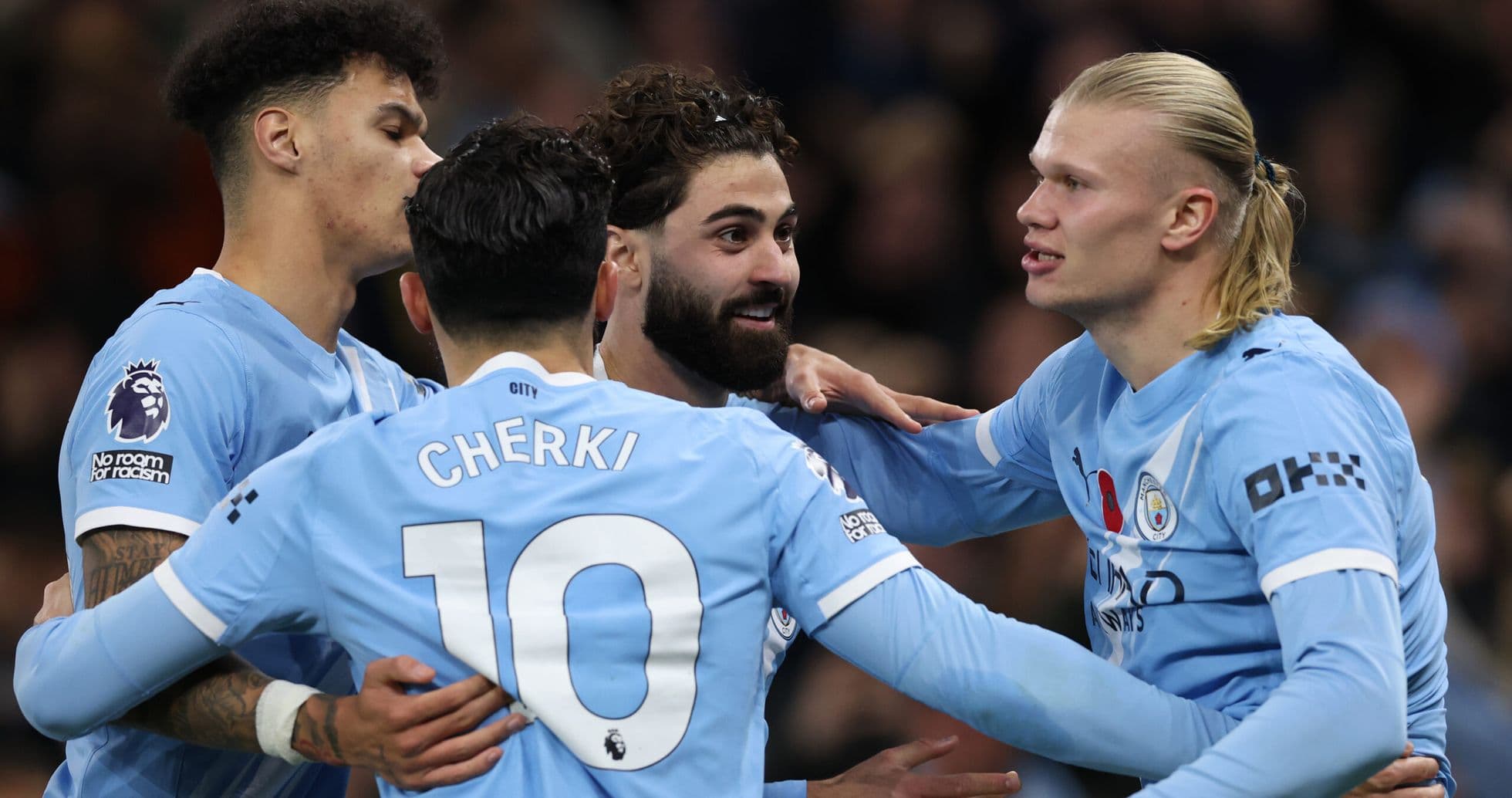 Jugadores de Manchester City celebrando un gol Jugadores de Manchester City celebrando un gol