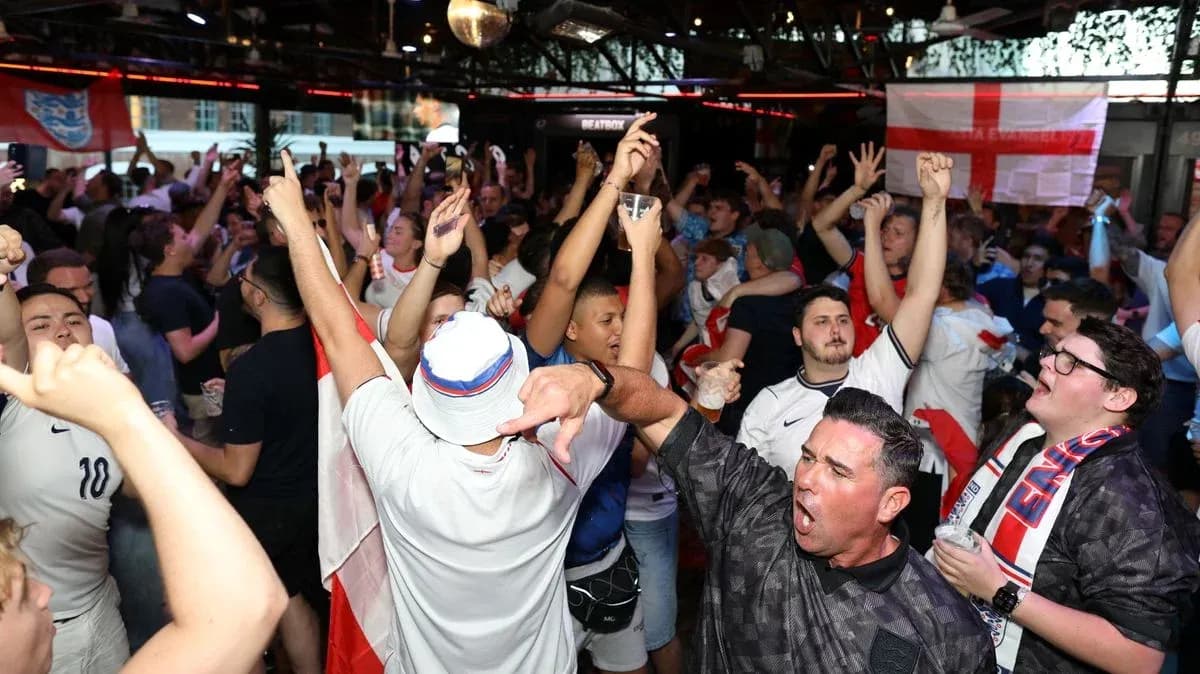 Agroup of fans celebrating in a crowded bar Agroup of fans celebrating in a crowded bar