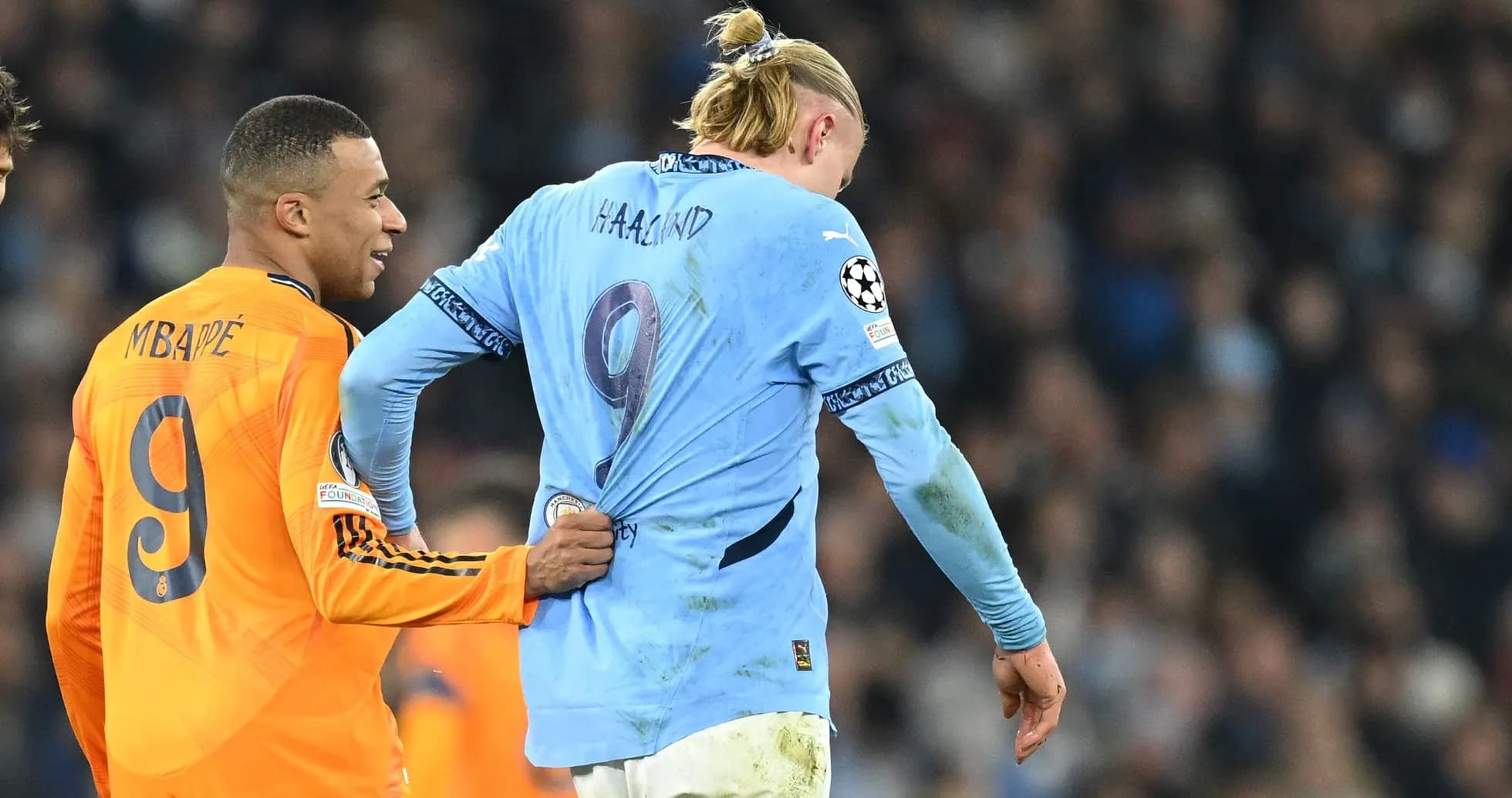 Mbappé pulling Haaland's shirt during match Mbappé pulling Haaland's shirt during match
